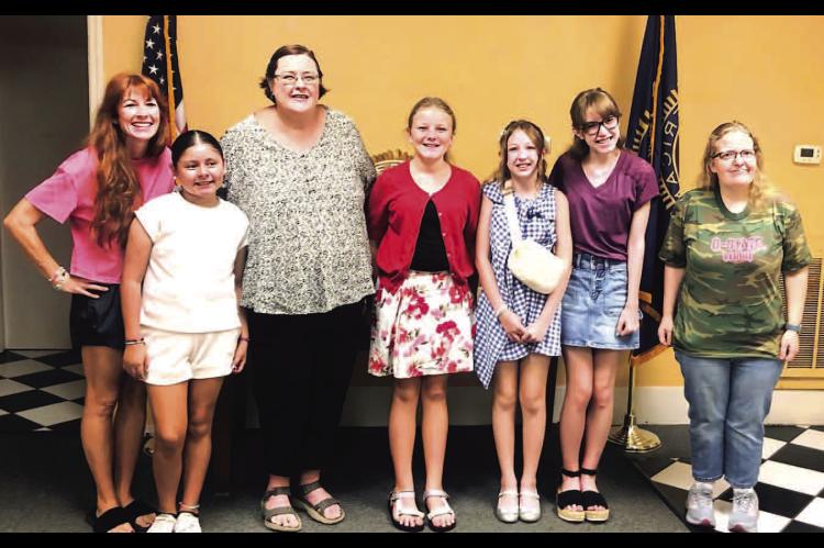 Local youth learn to quilt for a cause