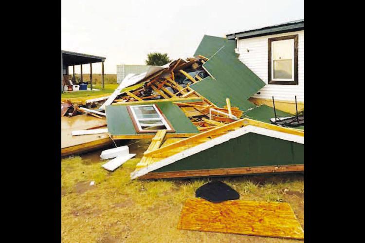 FRIDAY STORMS damaged this structure northwest of Kingfisher on County Road E760 (Lemon Road west of U.S. Highway 81). It was one of several structures damaged, including a number of power poles owned by Cimarron Electric. [Photo provided]