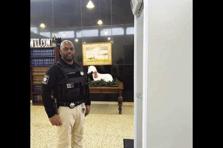 Metal detector in use at county courthouse