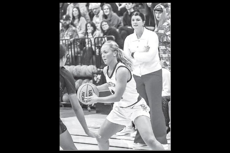 REESE ROOF - with head coach Taylor Young overseeing in the background - scored a game-high 18 points last Tuesday in Kingfisher’s 45-34 victory against Tuttle at the APB. [Photo by Chris Simon/www.simon-sports-photos.smugmug.com]