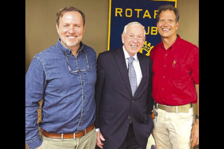 BILL PRICE, center, former U.S. attorney for the Western District of Oklahoma, was the guest speaker of the Kingfisher Rotary Club last Tuesday. He is pictured with his son James, left, and Brian Walter, president of the club. [KT&amp;FP Staff Photo]