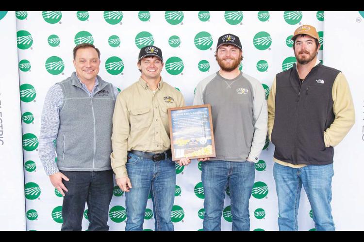 CIMARRON ELECTRIC CEO Aaron Roark, far left, with journeyman linemen, from left, Reid Trout, Jack Taylor and Zac Smith. The linemen recently took part in a project that help bring first-time electricity to an area of New Mexico. [Photo provided]