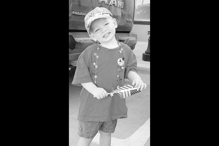 Briggs Leu of Hennessey was among the parade watchers on Saturday during the Fourth of July festivities in Kingfisher. This year’s parade had a record number of entries, according to Chamber Director Shauna Rupp. Leu is the son of Brooks and Hannah Leu of Hennessey. [KT&amp;FP Staff Photo by Twila Adams]