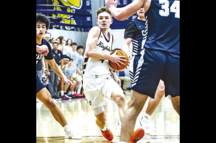 CASH LAIRD drives down the lane during the first half of last week’s game against Casady. Laird scored 18 points to help lead the Jackets to a 55-48 win. [Photo by Chris Simon/www. simon-sports-photos.smugmug.com]