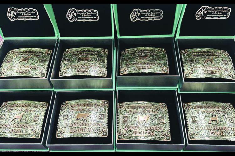 BUCKLE UP – Pictured are the buckles that will be awarded to the grand champions (above) at the Kingfisher County Livestock Show next week as well as the showmanship winners (right). There will also be buckles awarded to reserve grand champs and an over