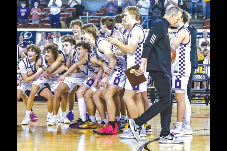 OKARCHE’S BOYS basketball team prepares to collect the gold ball after winning the 2025 Class A state championship, its second straight, last March. Many from that team will take the court in Tulsa this week at the 60th Tournament of Champions. [Photo b