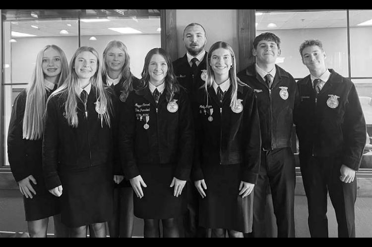 CASHION FFA members (above) attending Lead 360 in Sparks. Pictured right are members Cora Graham and Ashlynn Graham at the December chapter meeting. [Photos provided by Molly Mayes/Cashion FFA Reporter]