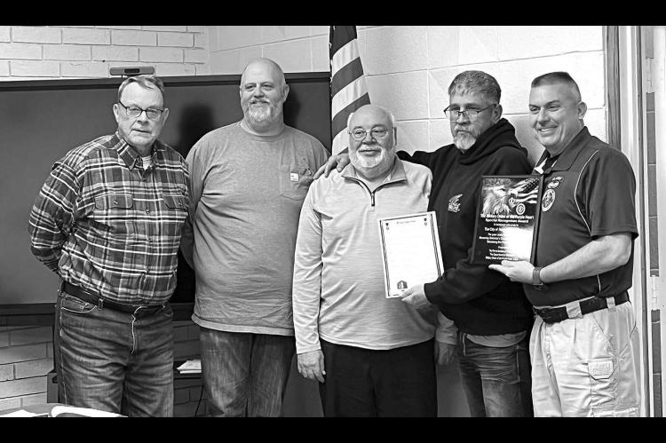 PURPLE HEART – With board approval, Mayor Harold Shaw proclaimed Hennessey as a “Purple Heart Town” during the board of trustees meeting last Tuesday. Pictured are, from left: Trustees David Jones, Randy Bohnstedt, Bert Gritz, Shaw and retired Milit