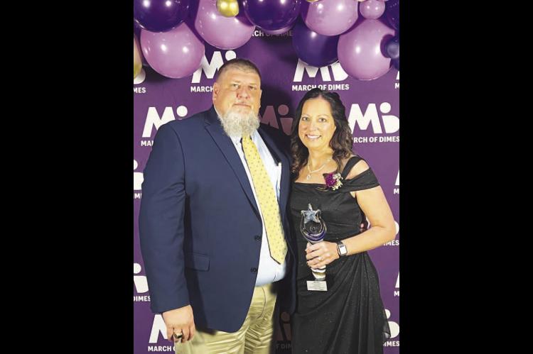 KINGFISHER RESIDENT Stacey Purintun earned a Nurse of the Year honor at the recent March of Dimes awards event held in Norman. She’s pictured with her husband, Stuart, after receiving her honor. [Photo provided]
