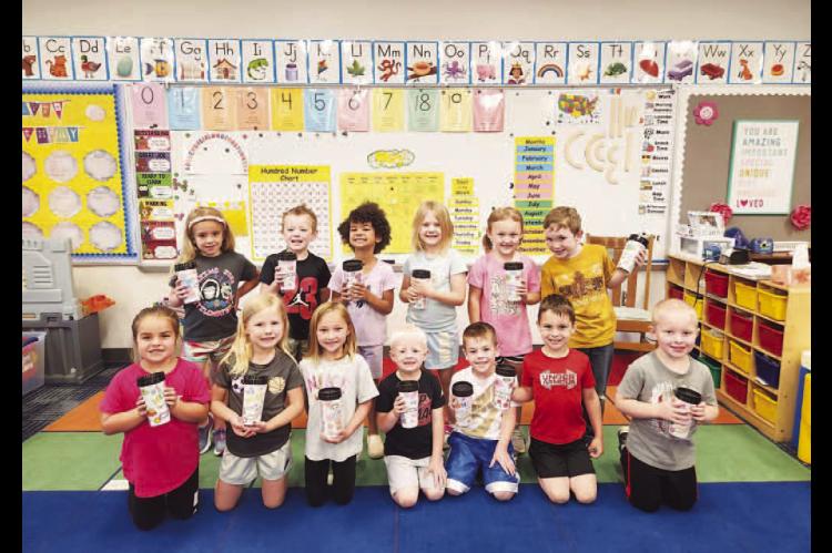 HAPPY MOTHER’S DAY – Students in Becky Hart’s pre-k class show off the special Mother’s Day gifts they made at school. Pictured are, from left: front row, Baker Fischer, Lyla Redwine, Kenna Pyle, Brooks Terrell, Wyatt Henton, Weston Mercer and Luk