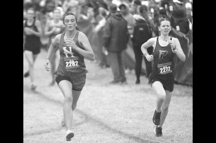 HENNESSEY’S Tayler Franklin, left, made up several places down the stretch of the Class 2A state cross country meet to finish 36th out of 135 competitors. [KT&FP Staff Photo]