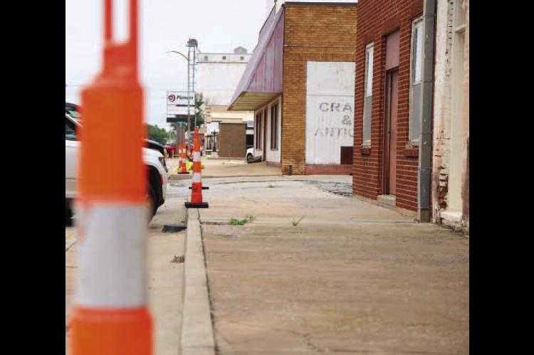 ODOT CREWS started placing cones and preliminary signage last week along three city streets that will be the focus of a sidewalk improvement project. Work begins Tuesday and is expected to take 60 to 90 days. [KT&amp;FP Staff Photo]