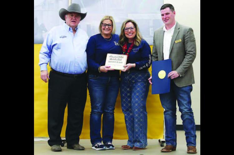 KINGFISHER CITY CLERK Brittney Hladik, second from left, was named Volunteer of the Year at the annual Chamber of Commerce banquet. She was nominated by City Manager Jim Thomas, left. Joining them are Chamber Executive Director Shauna Rupp and board membe