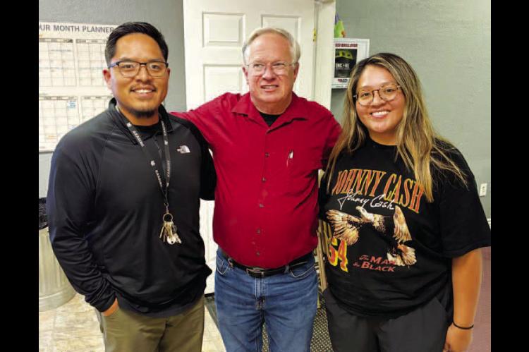 KINGFISHER CHURCH OF CHRIST Elder David Glasscock, center, with Evan and Christal Todachine, missionary and his wife and assistant, at the Arizona Navajo reservation, during a recent trip to deliver coats for needy tribal members. [Photo provided]