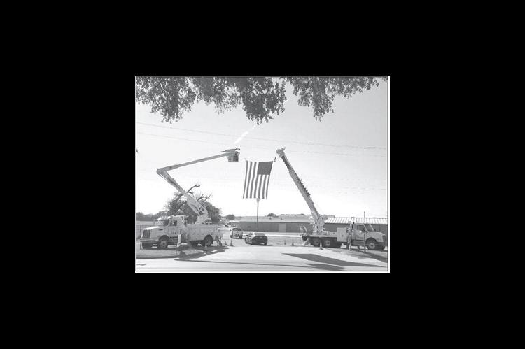 CIMARRON ELECTRIC trucks - and the American flag - greeted members to the cooperative’s annual meeting held in September at the Kingfisher County Fairgrounds. [KT&amp;FP Staff Photo]
