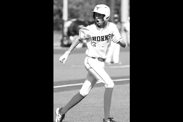 DOVER’S ETHAN DAYTON tries to fire up the Dover dugout after drawing a walk during the fourth inning of the Longhorns’ semifinal loss to Fort Cobb-Broxton. [KT&amp;FP Staff Photo]