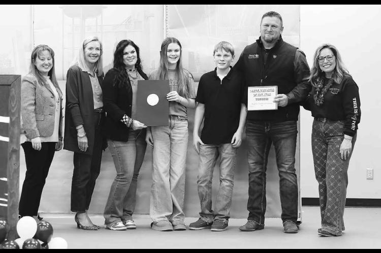 BUSINESS OF THE YEAR honors awarded at the Kingfisher Chamber of Commerce Banquet on Monday were presented to TerraStar, Inc. (large) and Skin and Beauty Esthetics (small). Wittrock family members pictured above accepting the honor were, beginning third f