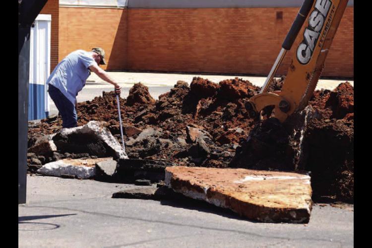 City crews work late Monday to ensure Gilmour students can to return to school