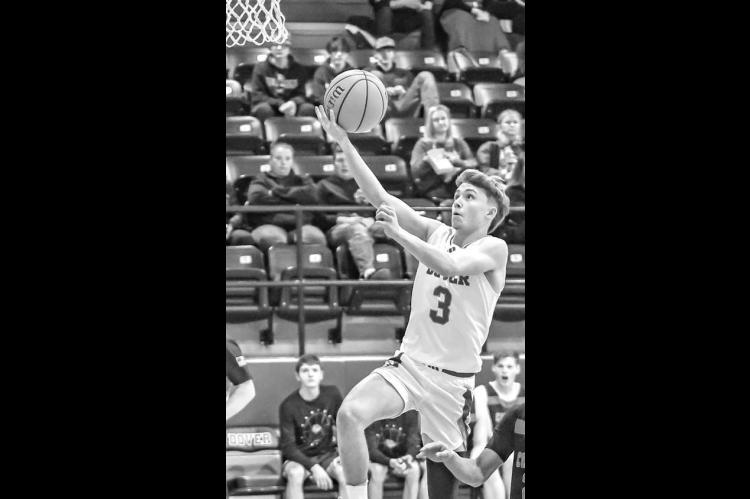JONAH PENDERGRAFT scored 21 points Monday as Dover downed Wilson (Henryetta) to win a Class B regional title in Earlsboro. [Photo by Chris Simon/www.simon-sports-photos. smugmug.com]