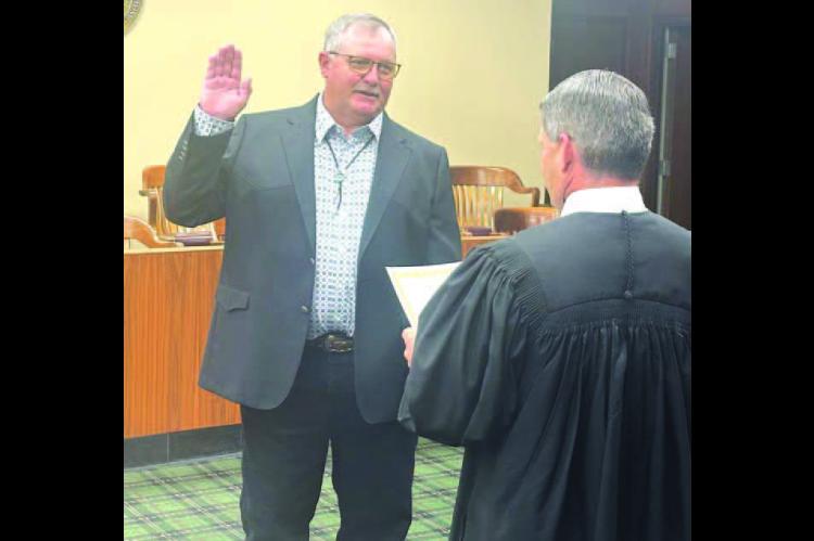 COUNTY COMMISSIONER Anthony Schwarz is pictured being sworn in by Judge Lance Schneiter after being elected in 2024. On Monday Schwarz was voted chairman of the board of county commissioners for the 2025 calendar year. [KT&amp;FP Staff Photo]