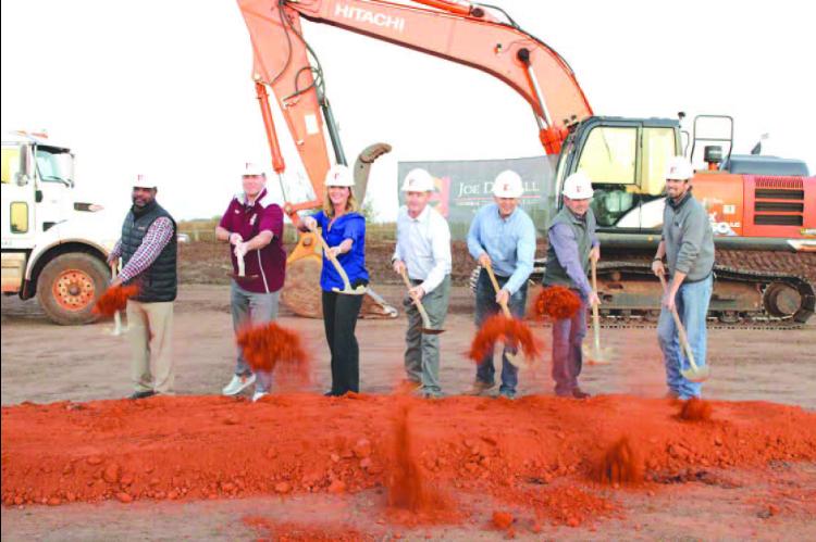 BREAKING GROUND Wednesday on the new Cashion High School were, from left: Cashion school board member Kelly Davis, Principal Ryan Schenk, board President Jessica Ballard, Superintendent Shane Hood, board Vice President Chris Carroll, board Deputy Clerk Ja