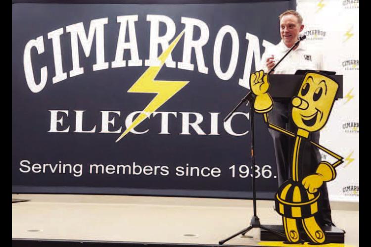 CIMARRON ELECTRIC CEO Aaron Roark addresses the large crowd during the cooperative’s 90th annual meeting at the Kingfisher County Fairgrounds on Thursday night. [KT&amp;FP Staff Photo]