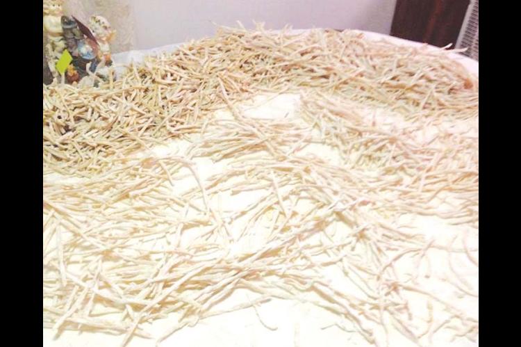 HOMEMADE NOODLES drying on my grandmother’s dining room table in 2012. This sight meant good meals were in store for the Swisher family.