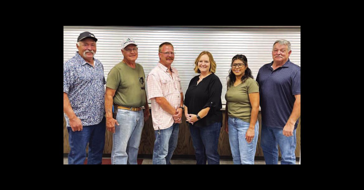 NEWLY-APPOINTED 522 ambulance district board members for Hennessey for are, from left, President Ray A. Shimanek, Treasurer Dr. David Matousek, Secretary Levi Copeland, Shelley Muzny and Vice President Perla Blanco. They’re pictured with Kingfisher County District 2 Commissioner Mike Sparks. [KT&amp;FP Staff Photo by Barb Walter]