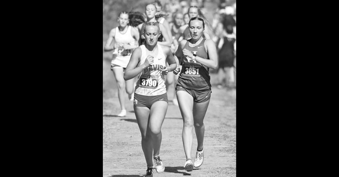 KINGFISHER COUNTY runners Julianne Matousek of Hennessey (3851 in left photo) and Cole Baustert of Cashion (3678 in right photo) made the medal stand in their respective Class 2A state cross country races last Saturday. [KT&FP Staff Photos]