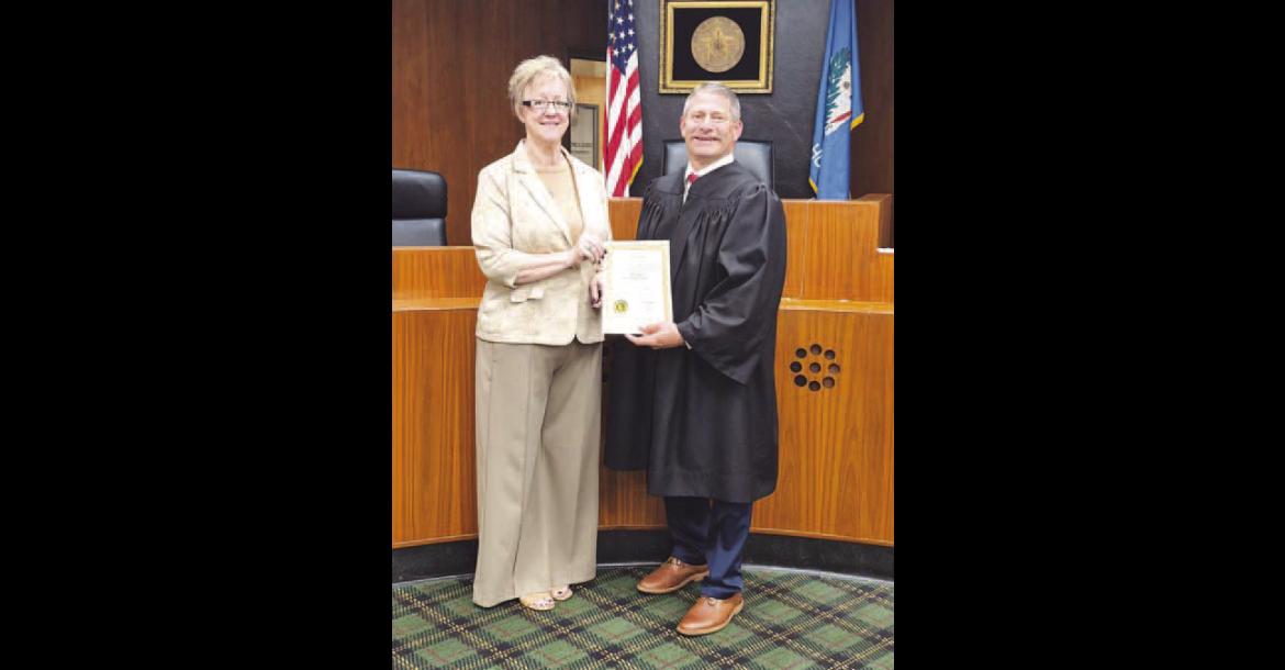 Kelly Majetic is officially the Kingfisher County treasurer. Majetic, left, was sworn into office Wednesday morning by Associate District Judge Lance Schneiter at the Kingfisher County Courthouse. She was appointed to fulfill the term of Robin Rother, whose retirement was effective at the end of business on Tuesday. Majetic will serve the final year of Rother’s term and then will begin her own four-year term in the office beginning next July. [Photo provided]