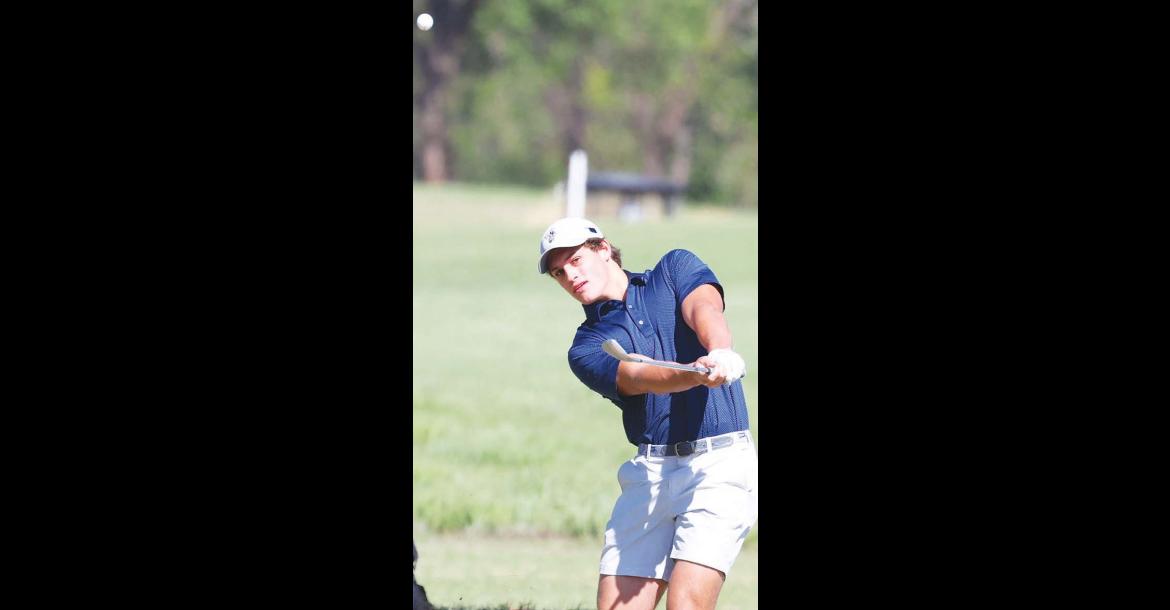 CALE REAGAN watches a chip shot during a golf tournament earlier this year. Reagan helped lead KHS to the state golf tournament and won an all-star tournament after the season. He’s pictured on the right side of the page during his junior year of football. A dominant defensive lineman for the Jackets, he was named the 3A-1 Defensive Player of the Year as a senior. [Golf photo by KT&FP Staff/Football photo by Chris Simon