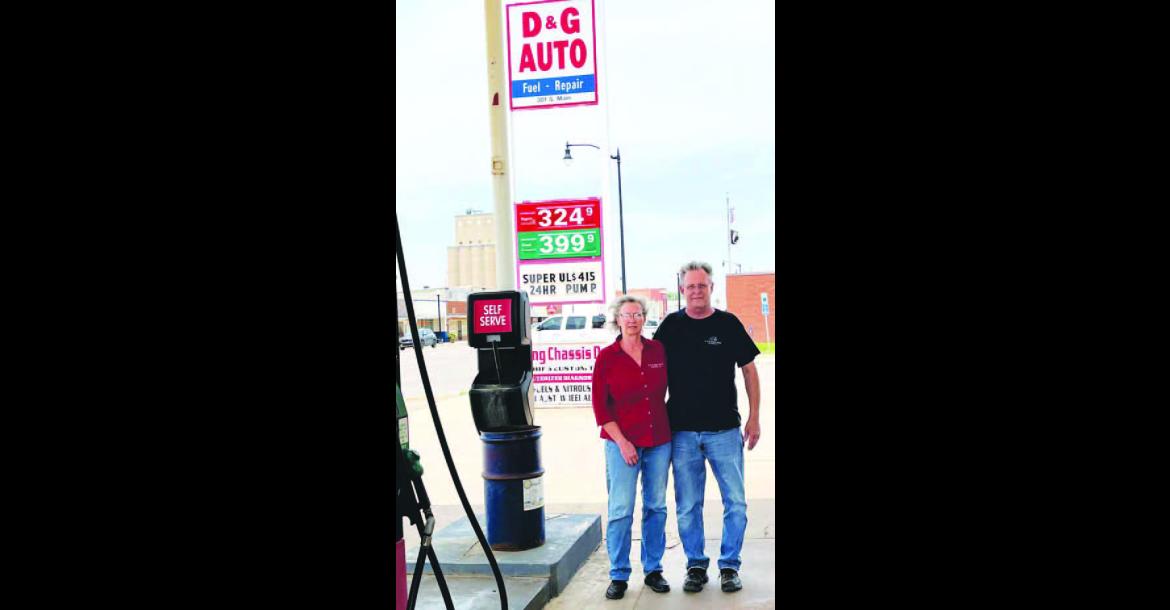 READY TO RETIRE – Grace and Dewayne Ebers stand outside their service station, D&amp;G Auto, in Hennessey. The longtime owners and operators are “semi-retiring” at the end of the week as they prepare to meet their new grandchild in Texas. [Photo by Barb Walter]