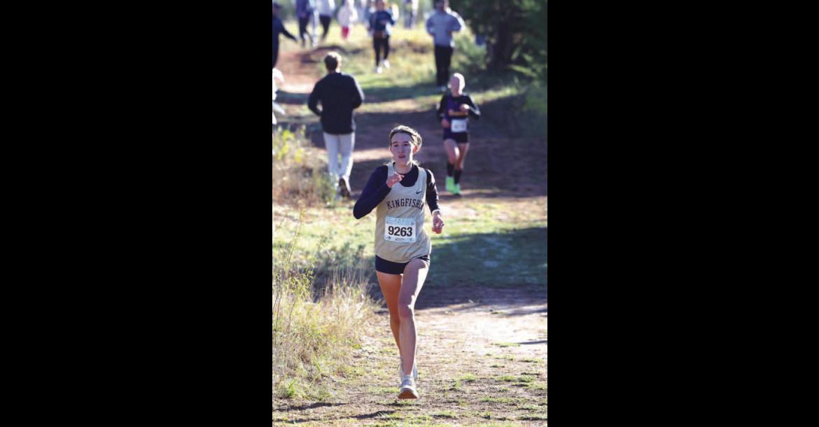 KHS SENIOR Addison Price prepares to run the final stretch of last Saturday’s 4A cross country regional. She passed two runners during that stretch and placed 41st to help KHS qualify for state. [KT&amp;FP Staff Photo]