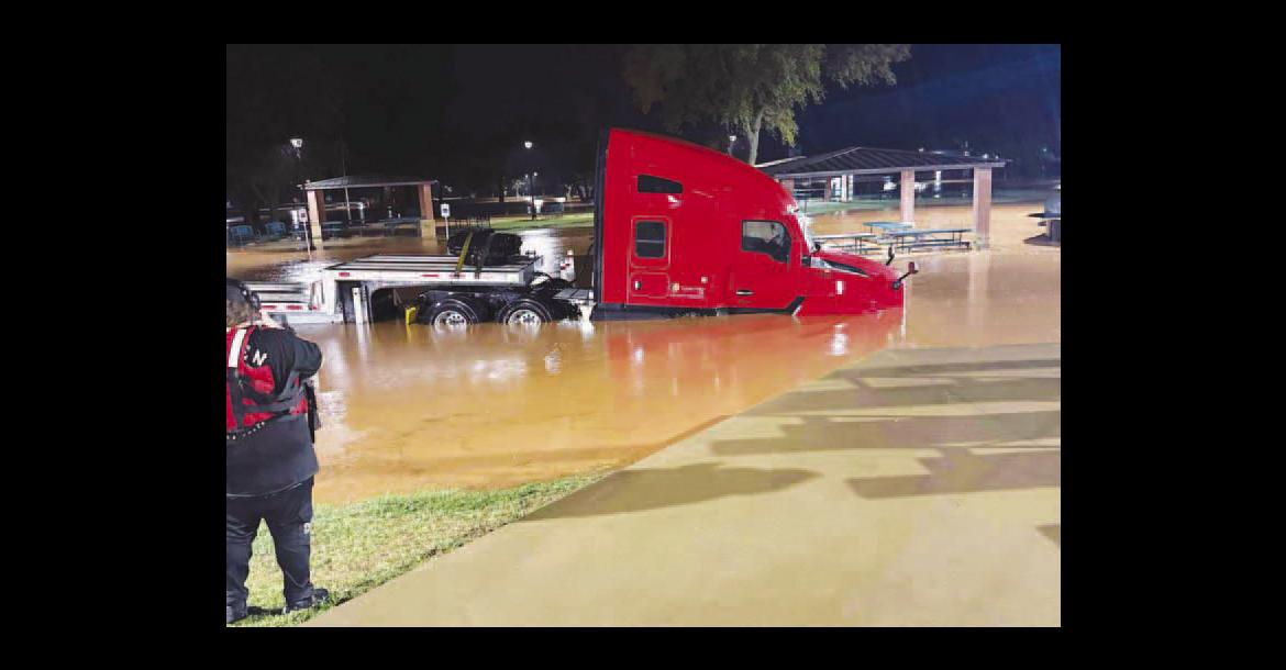 CAN’T PARK THERE – Pictured is one of multiple semi-trucks that were stranded in Kingfi sher overnight Wednesday, requiring rescues by Kingfisher Fire Department personnel as heavy rains flooded parts of the city and county. [Photo provided by KFD]