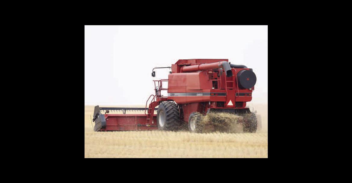 KENNETH KARRENBROCK cuts wheat east of Kingfisher at the beginnig of the harvest season. Others in the county were able to resume after rains late last week, but more rain is in the forecast for this week. [KT&amp;FP Staff Photo]