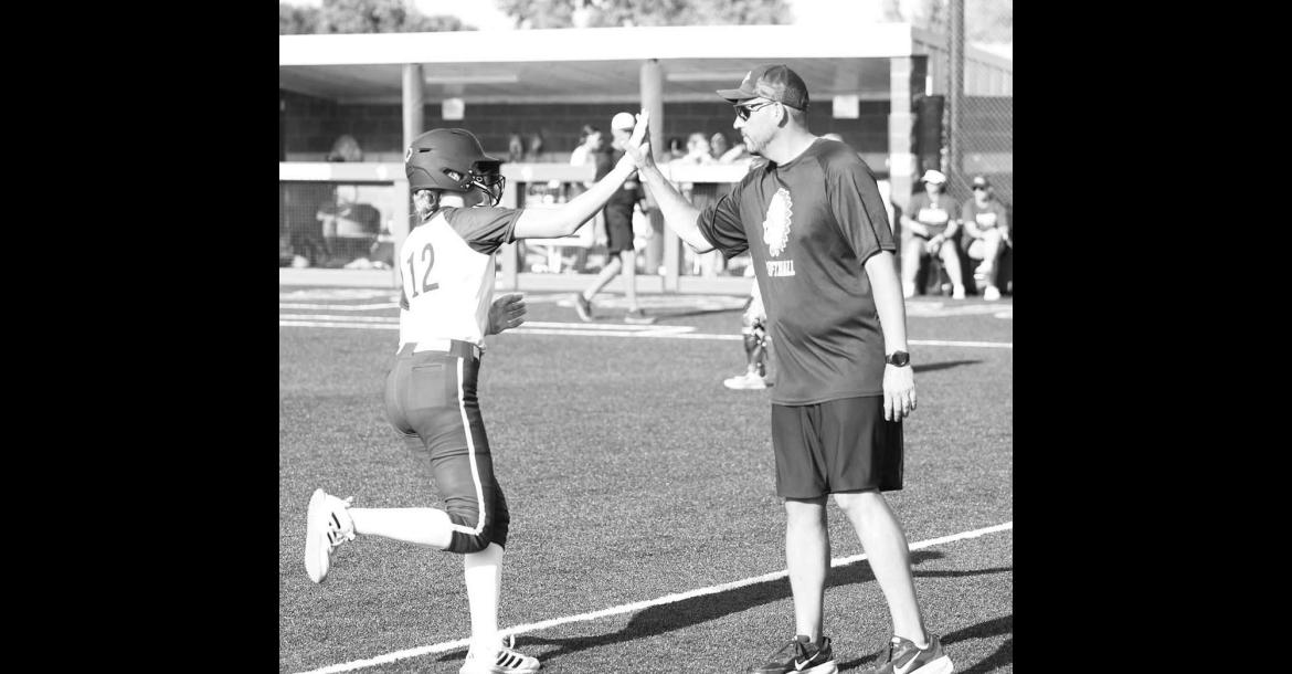 OKARCHE INFIELDER Kinley Pruett high-fives coach Scott Tahah after hitting a home run earlier this season. Pruett, Tahah and the rest of the Lady Warriors qualified for state by winning their regional last week. [KT&amp;FP Staff Photo]