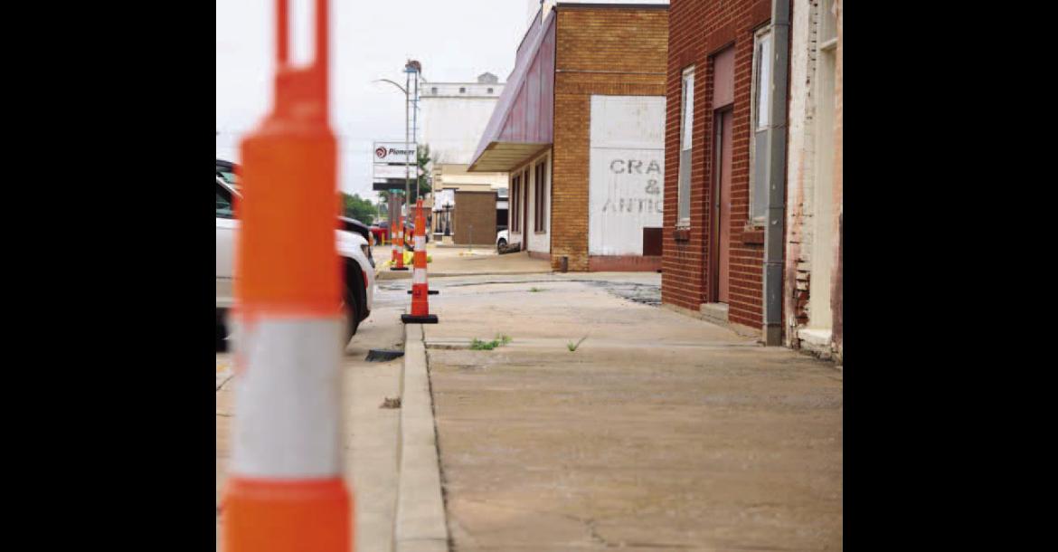 ODOT CREWS started placing cones and preliminary signage last week along three city streets that will be the focus of a sidewalk improvement project. Work begins Tuesday and is expected to take 60 to 90 days. [KT&amp;FP Staff Photo]