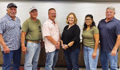 NEWLY-APPOINTED 522 ambulance district board members for Hennessey for are, from left, President Ray A. Shimanek, Treasurer Dr. David Matousek, Secretary Levi Copeland, Shelley Muzny and Vice President Perla Blanco. They’re pictured with Kingfisher County District 2 Commissioner Mike Sparks. [KT&amp;FP Staff Photo by Barb Walter]