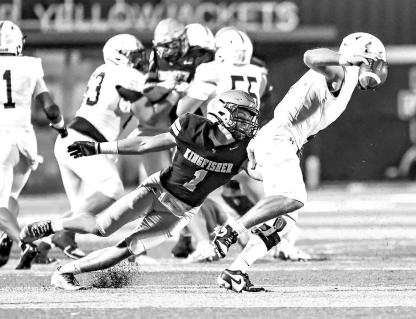 KHS LINEBACKER Brody Boeckman (1) brings down Marlow quarterback Brendan Weber during action Thursday night. Boeckman led KHS with seven tackles. He also had 72 receiving yards and recovered an onside kick on special teams. Pictured left is freshman Steel Snodgrass after catching a pass. Snodgrass ignited the Jackets with a 99-yard kickoff return for a TD in the fi rst half. [Photos by Chris Simon/ www.simon-sports-photos. smugmug.com]