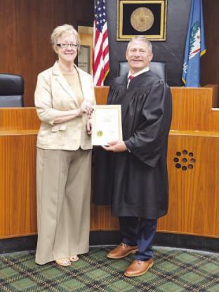 Kelly Majetic is officially the Kingfisher County treasurer. Majetic, left, was sworn into office Wednesday morning by Associate District Judge Lance Schneiter at the Kingfisher County Courthouse. She was appointed to fulfill the term of Robin Rother, whose retirement was effective at the end of business on Tuesday. Majetic will serve the final year of Rother’s term and then will begin her own four-year term in the office beginning next July. [Photo provided]