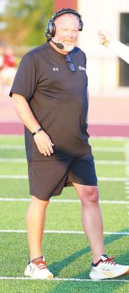 KINGFISHER AND CASHION face off for the first time in a varsity football game this week. Wildcat coach Lynn Shackelford (left) and KHS head coach Reagan Roof (right) both feel this could - and should - be the first of many showdowns between the two county schools. [KT&FP Staff Photos]