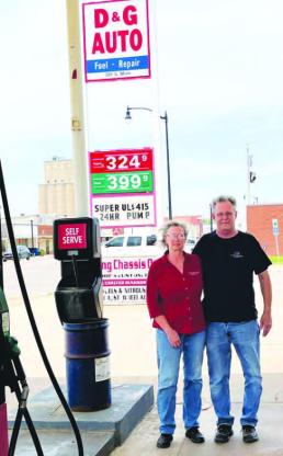 READY TO RETIRE – Grace and Dewayne Ebers stand outside their service station, D&amp;G Auto, in Hennessey. The longtime owners and operators are “semi-retiring” at the end of the week as they prepare to meet their new grandchild in Texas. [Photo by Barb Walter]