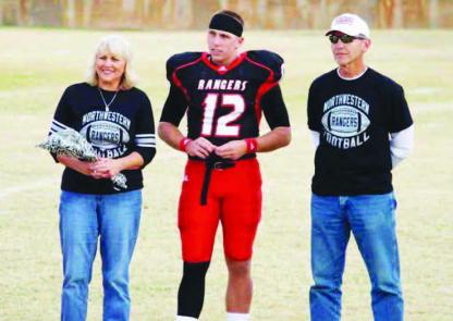 FORMER KHS and NWOSU quarterback Kyle Jech, center, is pictured with his parents Kim and and Doug Jech during the senior season of his collegiate career. It was announced last week Jech will be inducted into the Ranger Hall of Fame in 2027. [Photo provided]