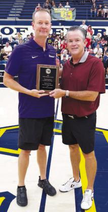 Okarche boys basketball coach was honored last weekend during the Oklahoma Basketball Coaches Association’s annual all-star weekend. West, left, was presented the OBCA’s 2026 Willis Mackey Award for Small-School Coach of the Year. He’s being presented the honor by Kenny Bare of Velma-Alma, the current OBCA president. West guided Okarche to a 29-3 record and its third consecutive Class A state championship during the 2025-26 season. 