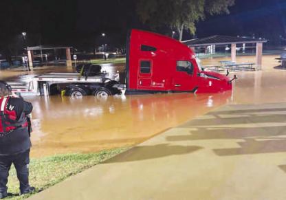 CAN’T PARK THERE – Pictured is one of multiple semi-trucks that were stranded in Kingfi sher overnight Wednesday, requiring rescues by Kingfisher Fire Department personnel as heavy rains flooded parts of the city and county. [Photo provided by KFD]