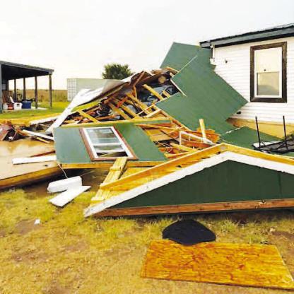 FRIDAY STORMS damaged this structure northwest of Kingfisher on County Road E760 (Lemon Road west of U.S. Highway 81). It was one of several structures damaged, including a number of power poles owned by Cimarron Electric. [Photo provided]